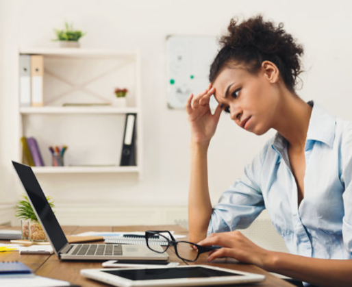 Woman looking at laptop